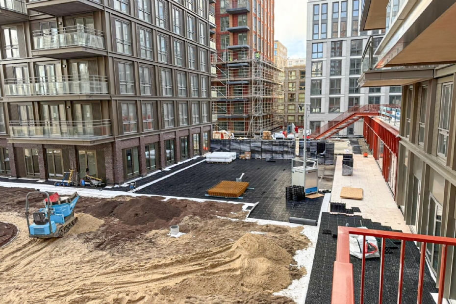 De gemeenschappelijke tuin heeft een secundaire functie als waterberging